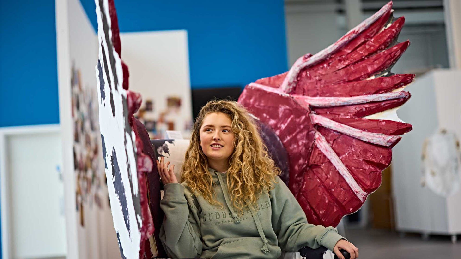 Art and Illustration student sat in her custom handmade chair