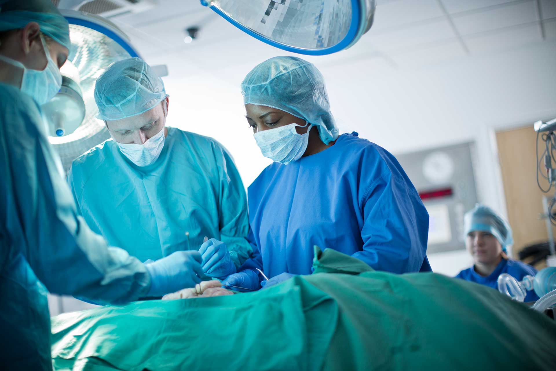 Students working as a team in simulated operating theatre